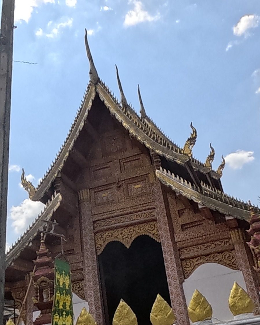 Wat Pha Bong's carved viharn front with tiered roof