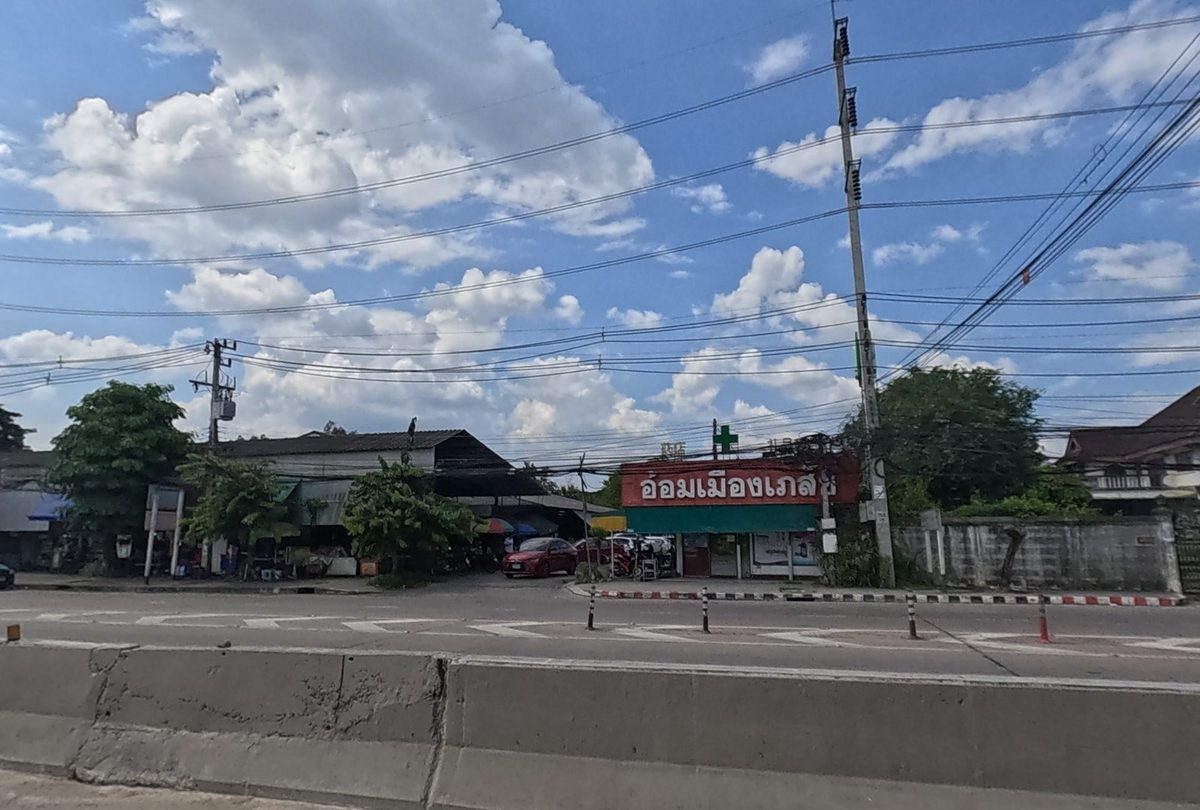 Om Mueang Pharmacy, seen from the road