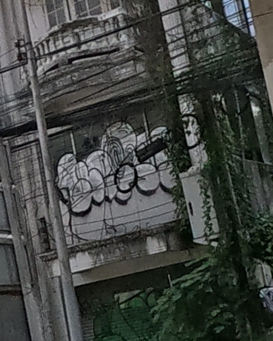 Graffiti tags on an abandoned shophouse