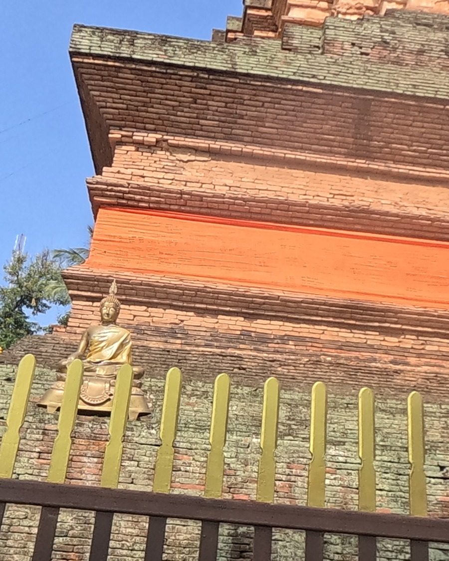 Old brick chedi with a Buddha niche