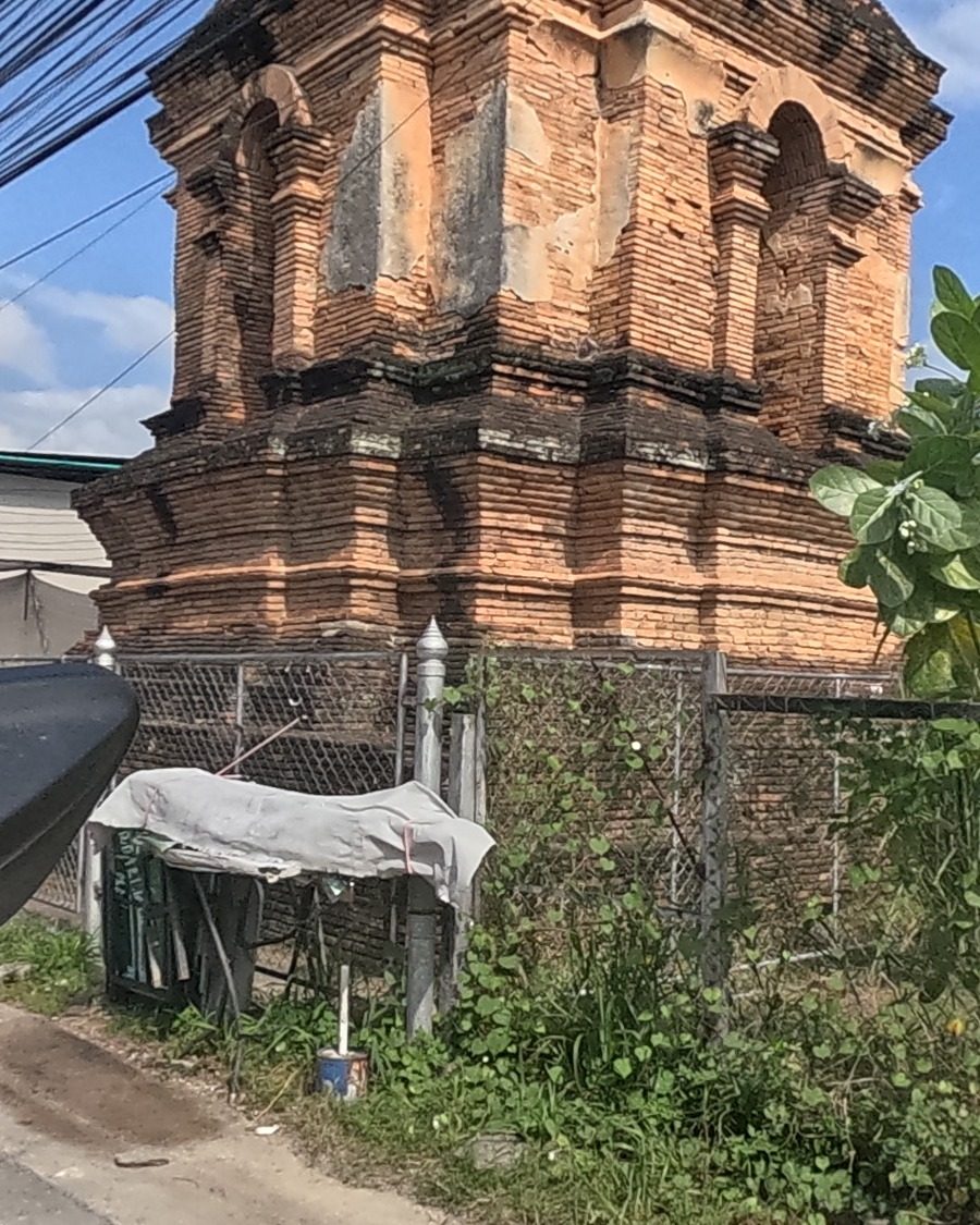 An old brick chedi, fenced and forgotten