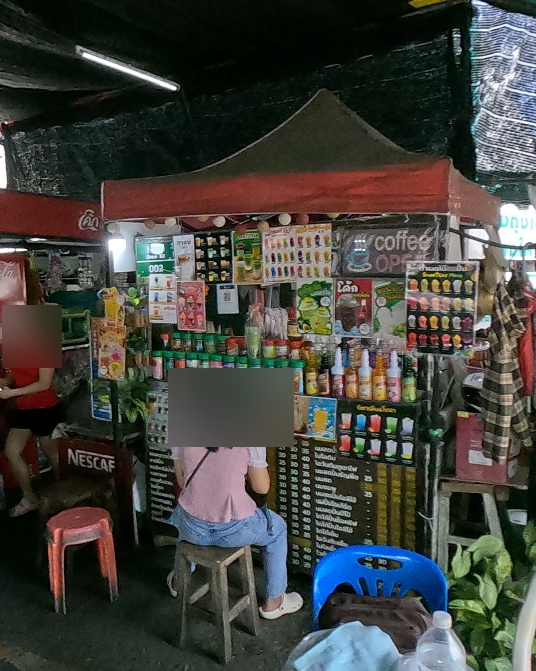 The coffee stall's wall of drinks