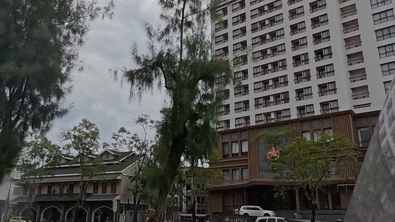 Moat road with hotel and old shophouses