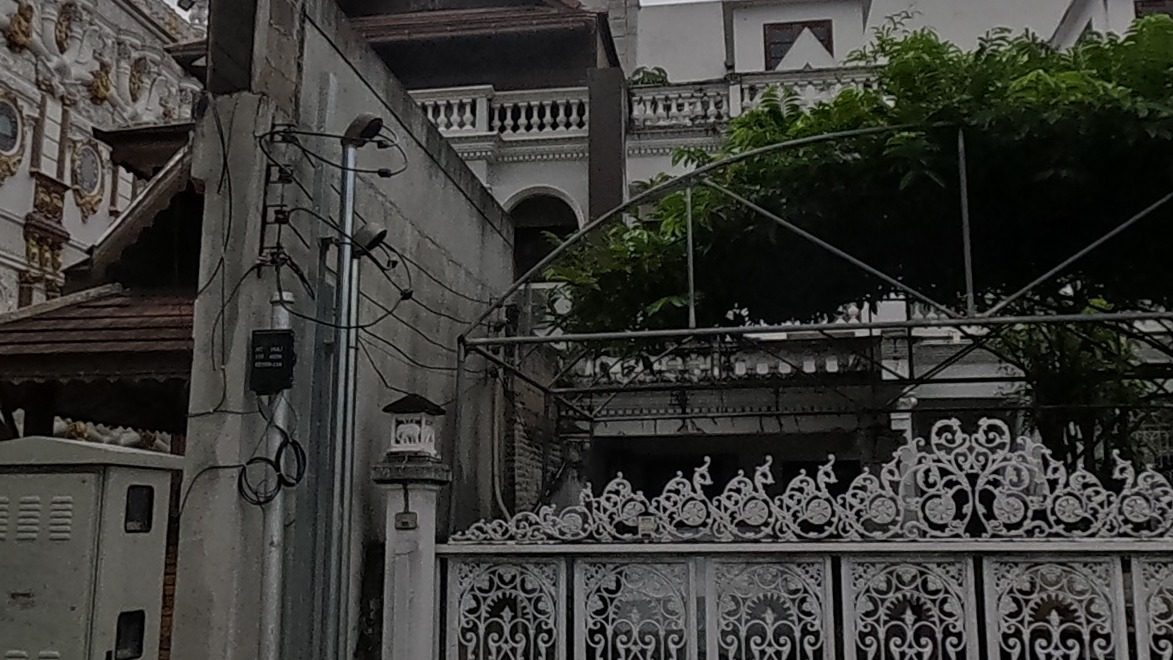 Ornate iron fence, grand villa
