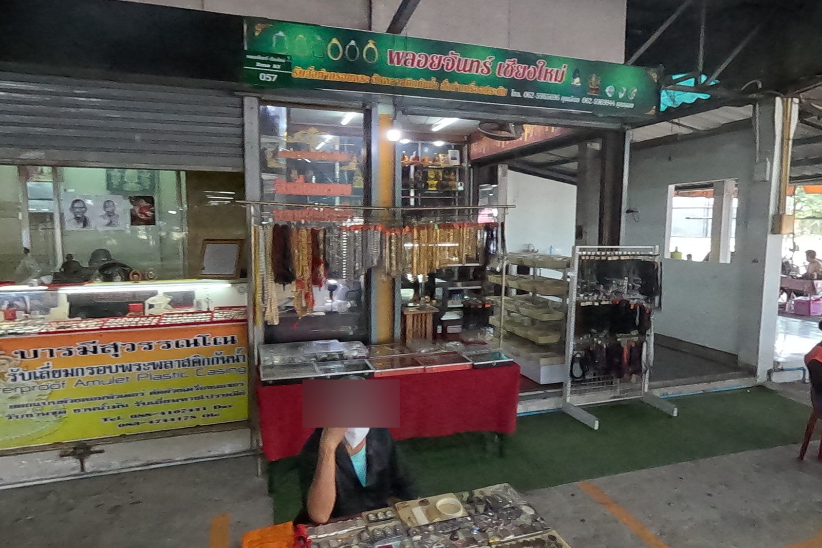 Amulet frame and bead shop at the market