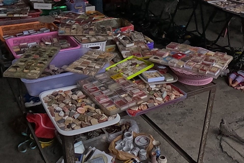 Trays of boxed amulets and loose tablets