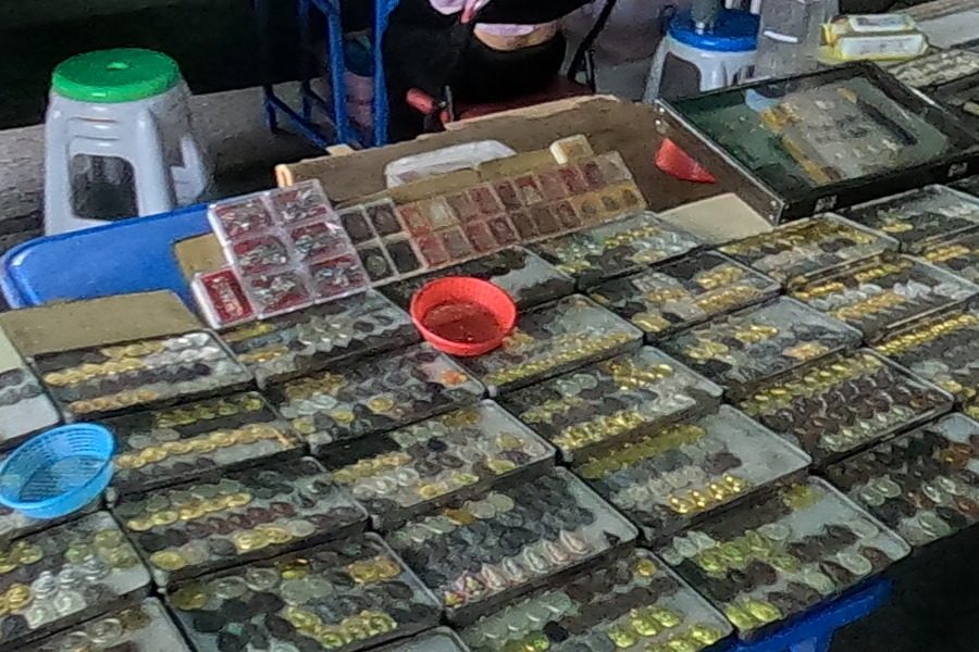 Trays of gold-rimmed amulets