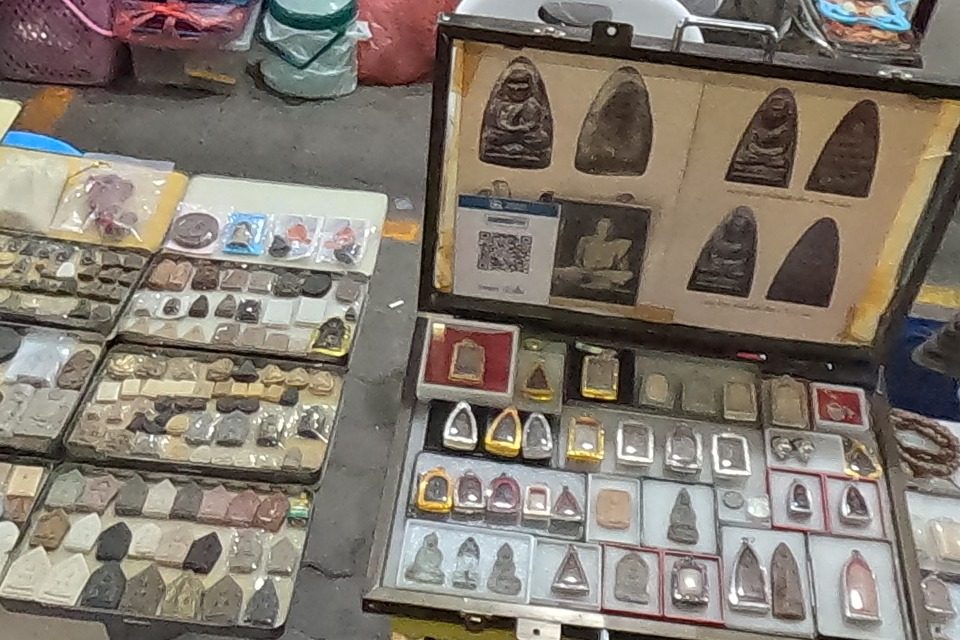 Trays of clay amulets and a framed display
