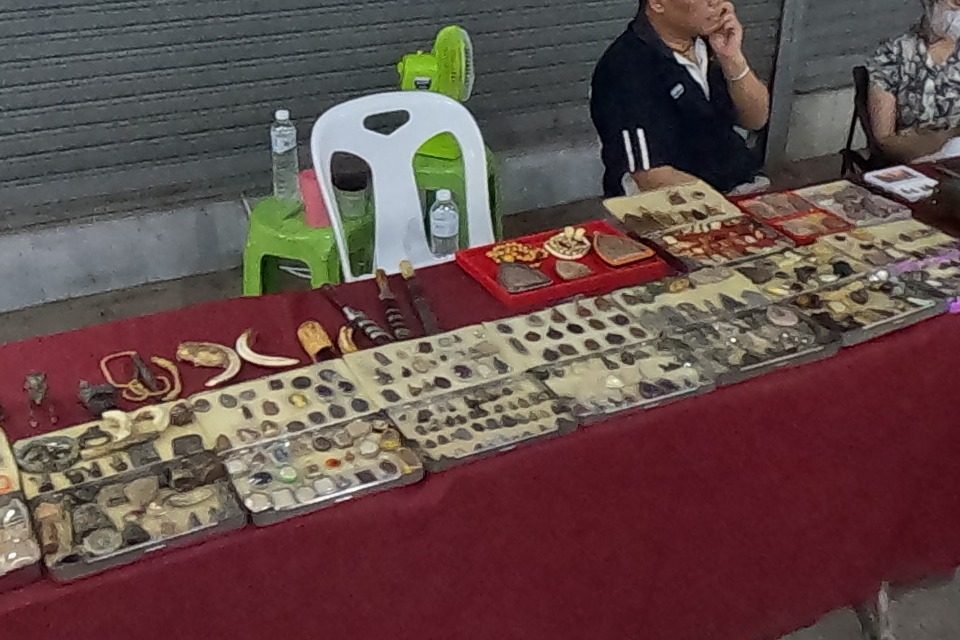 Old amulets, fangs and monk figures