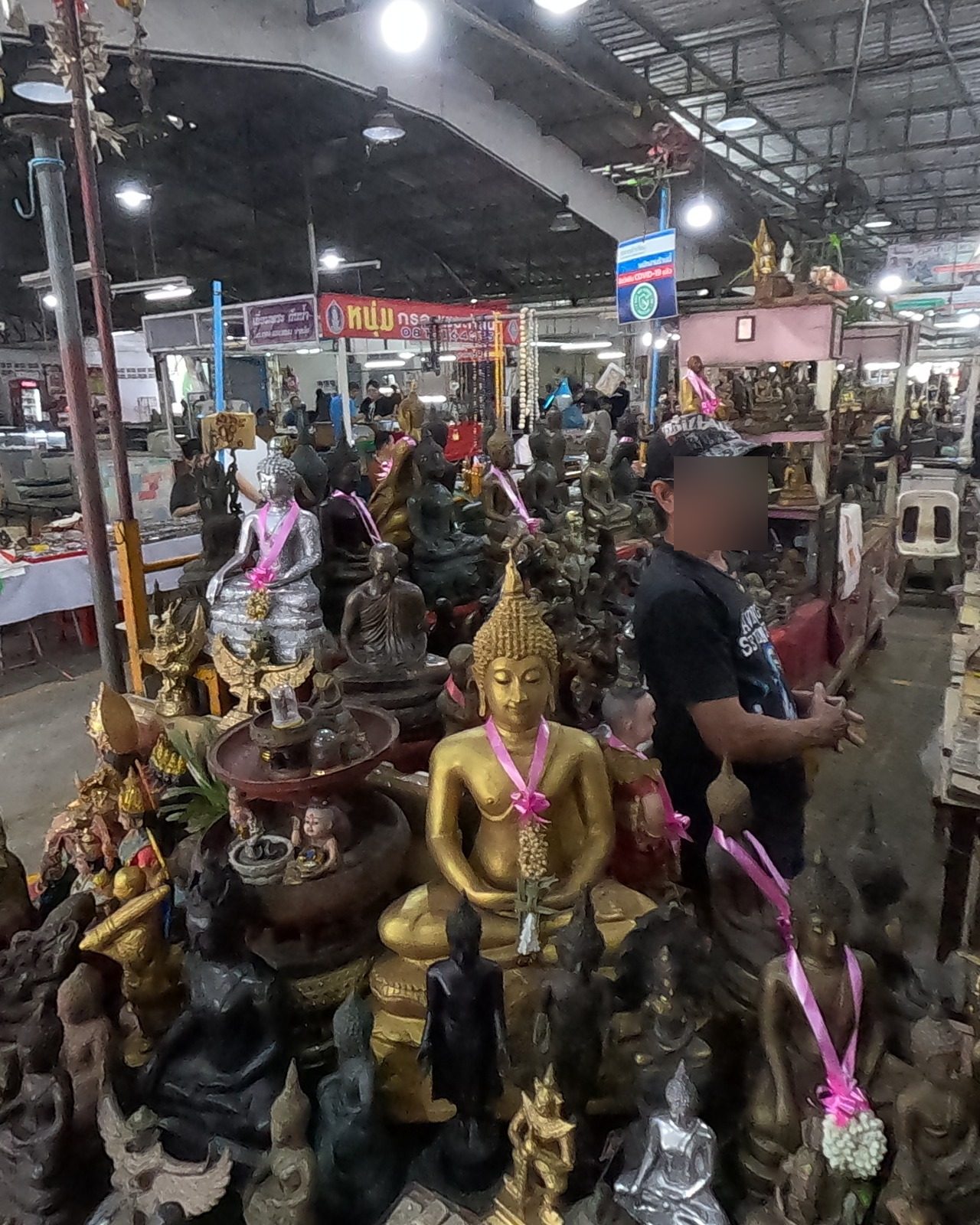 Buddha images under a gilt umbrella