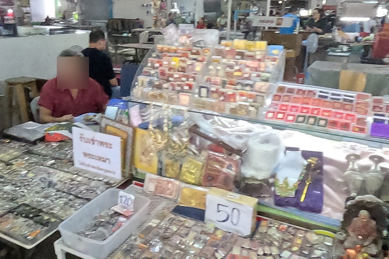 Boxed amulets under a 'buying' sign