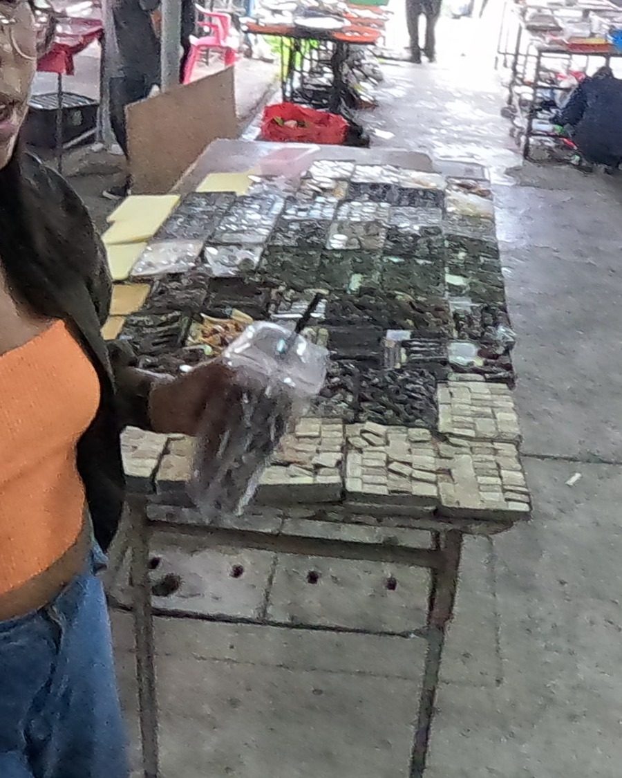 Trays of dark and pale amulets