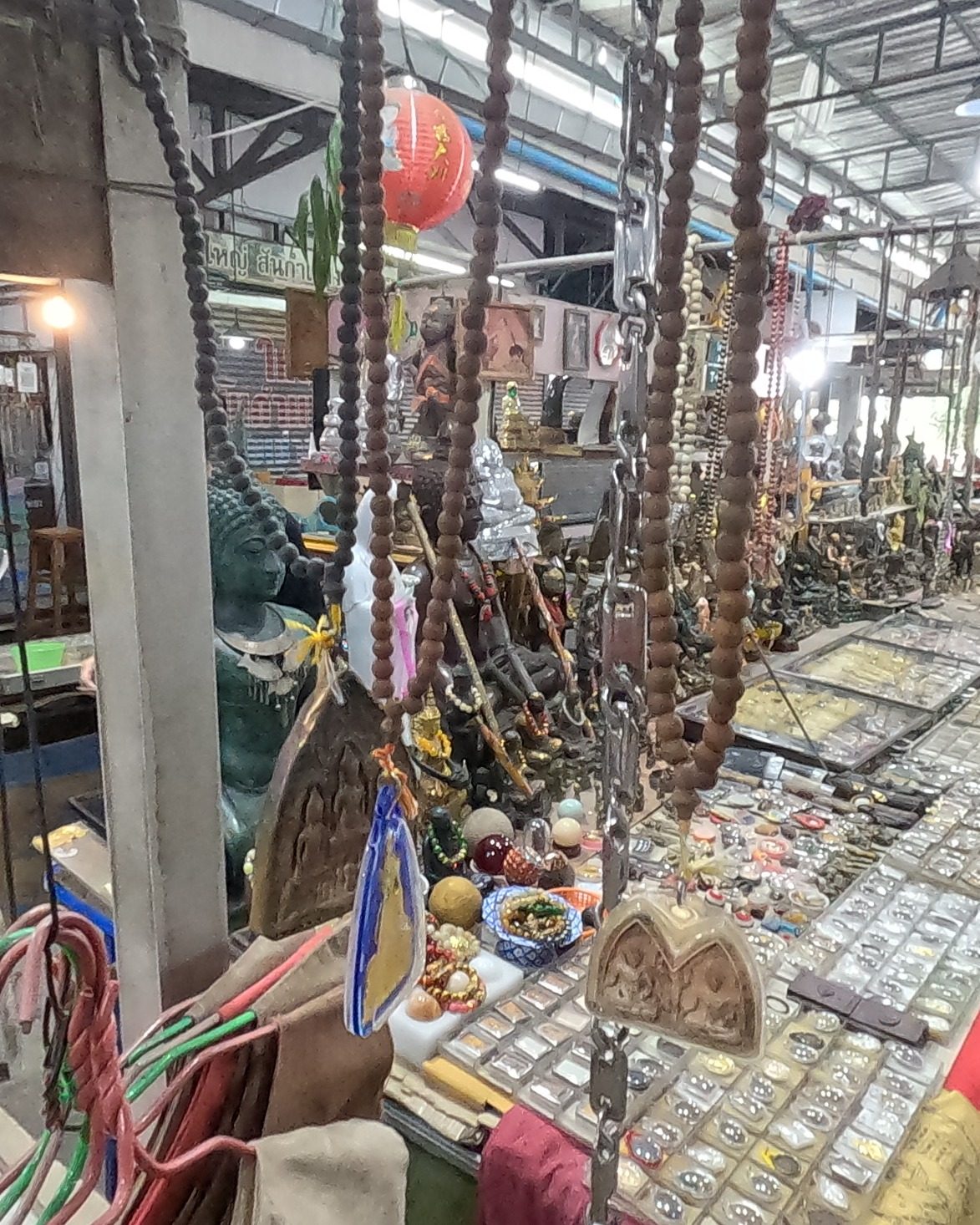 Prayer beads over a case of amulets