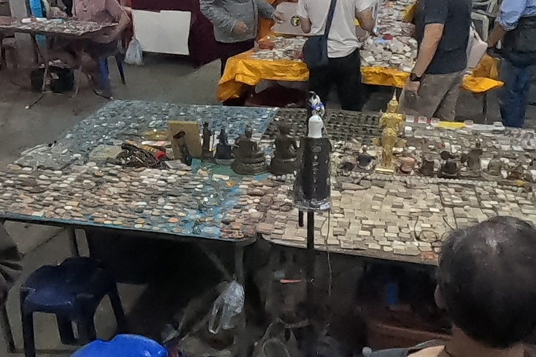 Rows of powder amulets and coin amulets