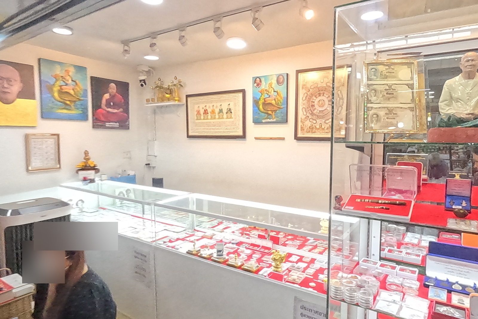 A small amulet shop, framed and lit