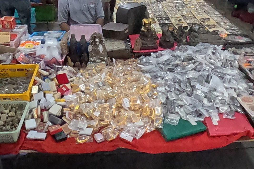 Amulets by the heap, in gold and silver packets