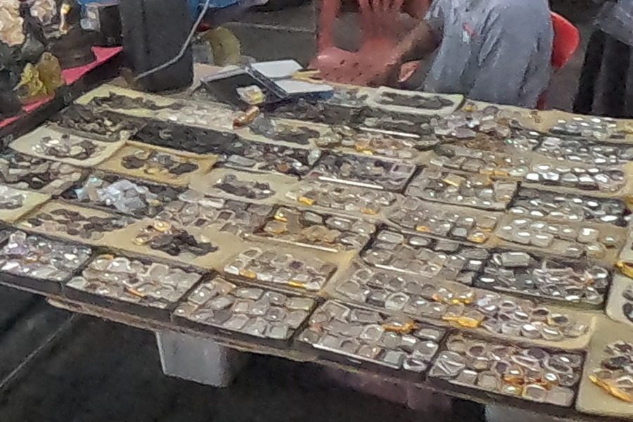 Cased amulets on yellow cards