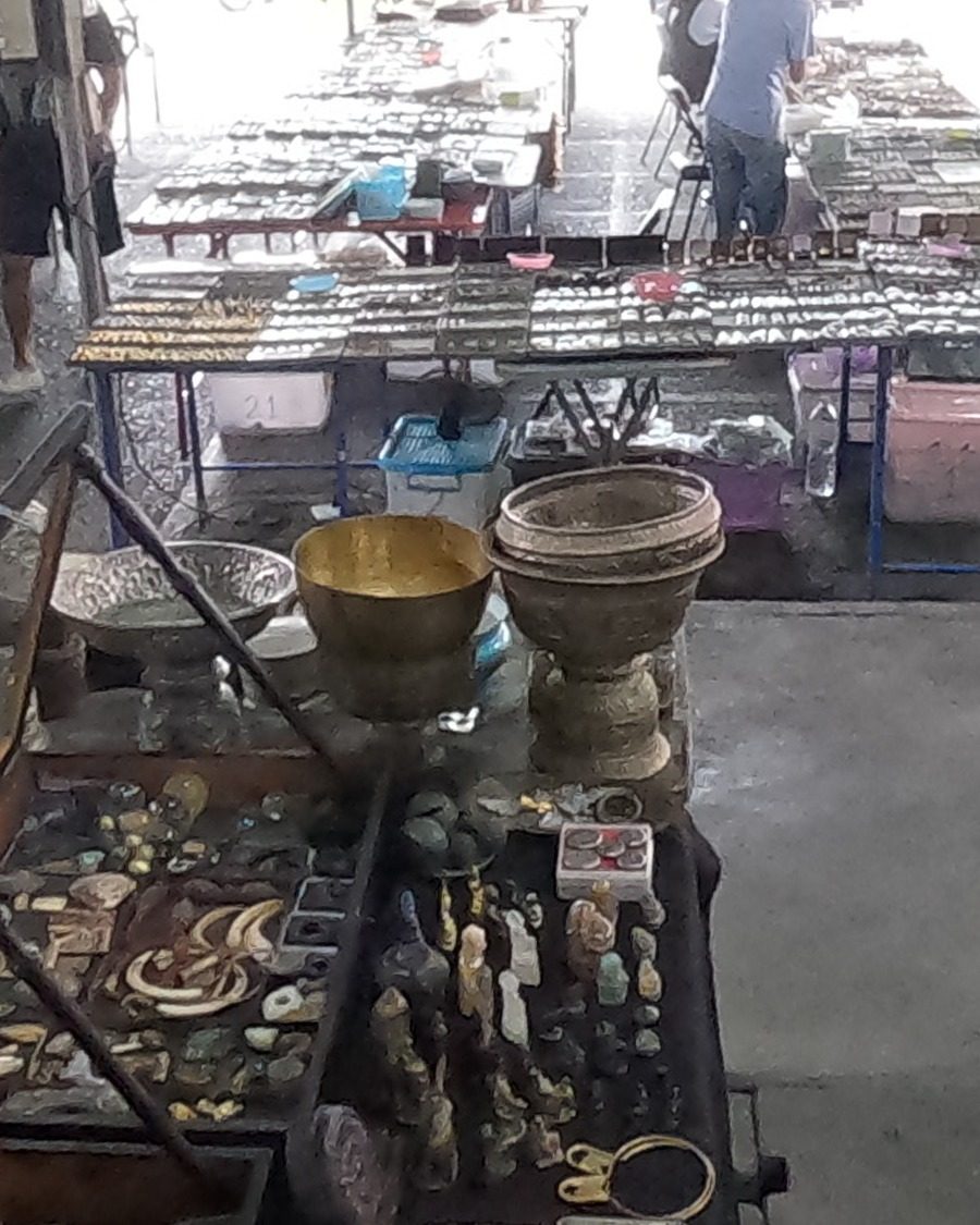 Brass bowls on a curio case