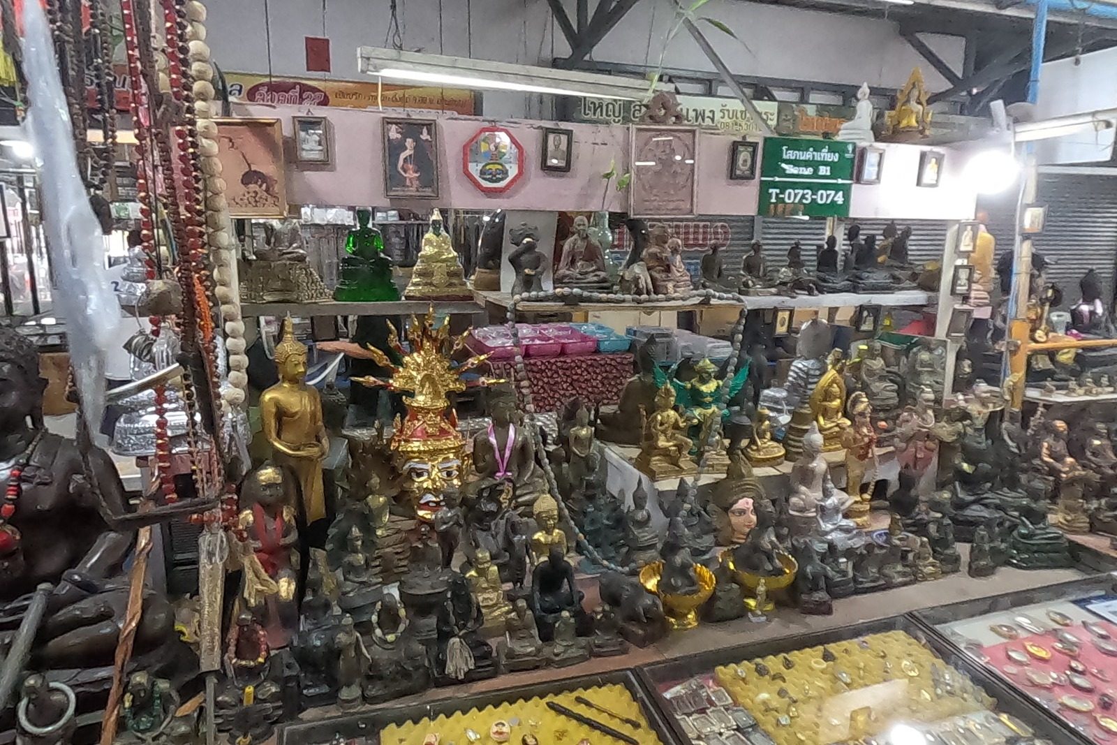 A Buddha image stall in the amulet market