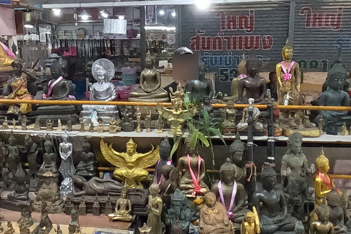 Gold garuda and bronze Buddha images