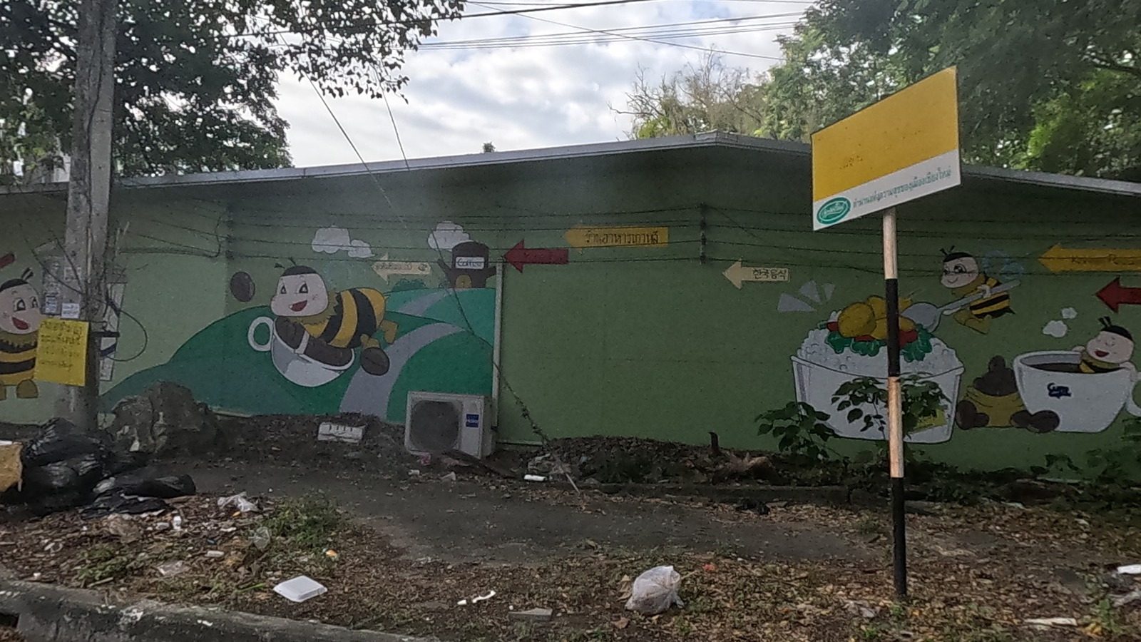 cartoon bee mural on a coffee-shop wall
