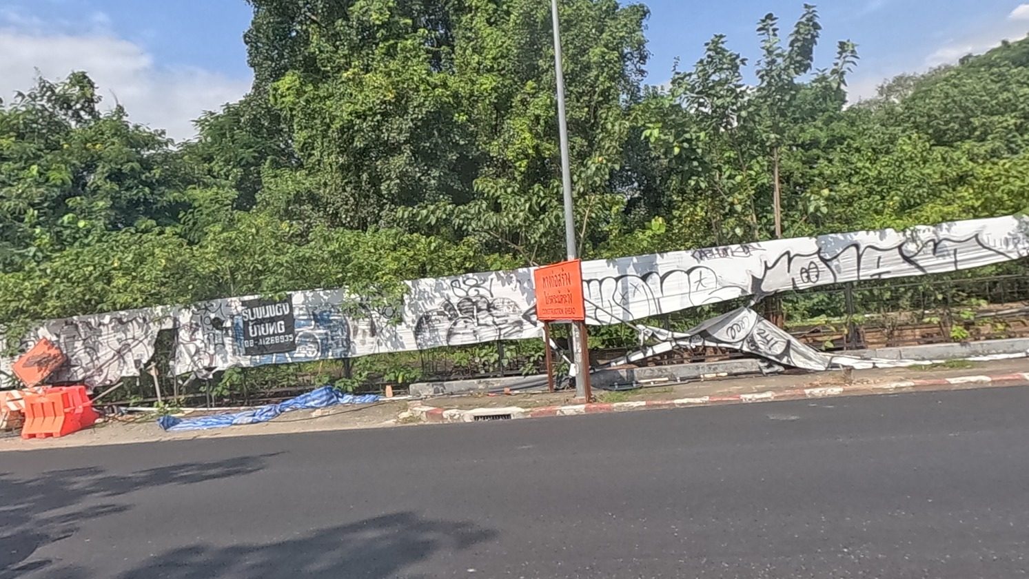 Long bombing wall of black tags