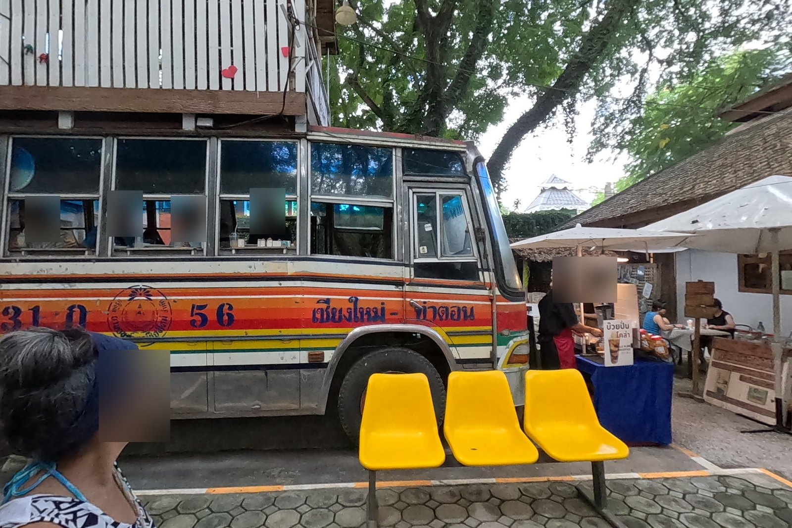 Old Chiang Mai - Tha Ton bus parked in the market — Chamcha Market, San Kamphaeng
