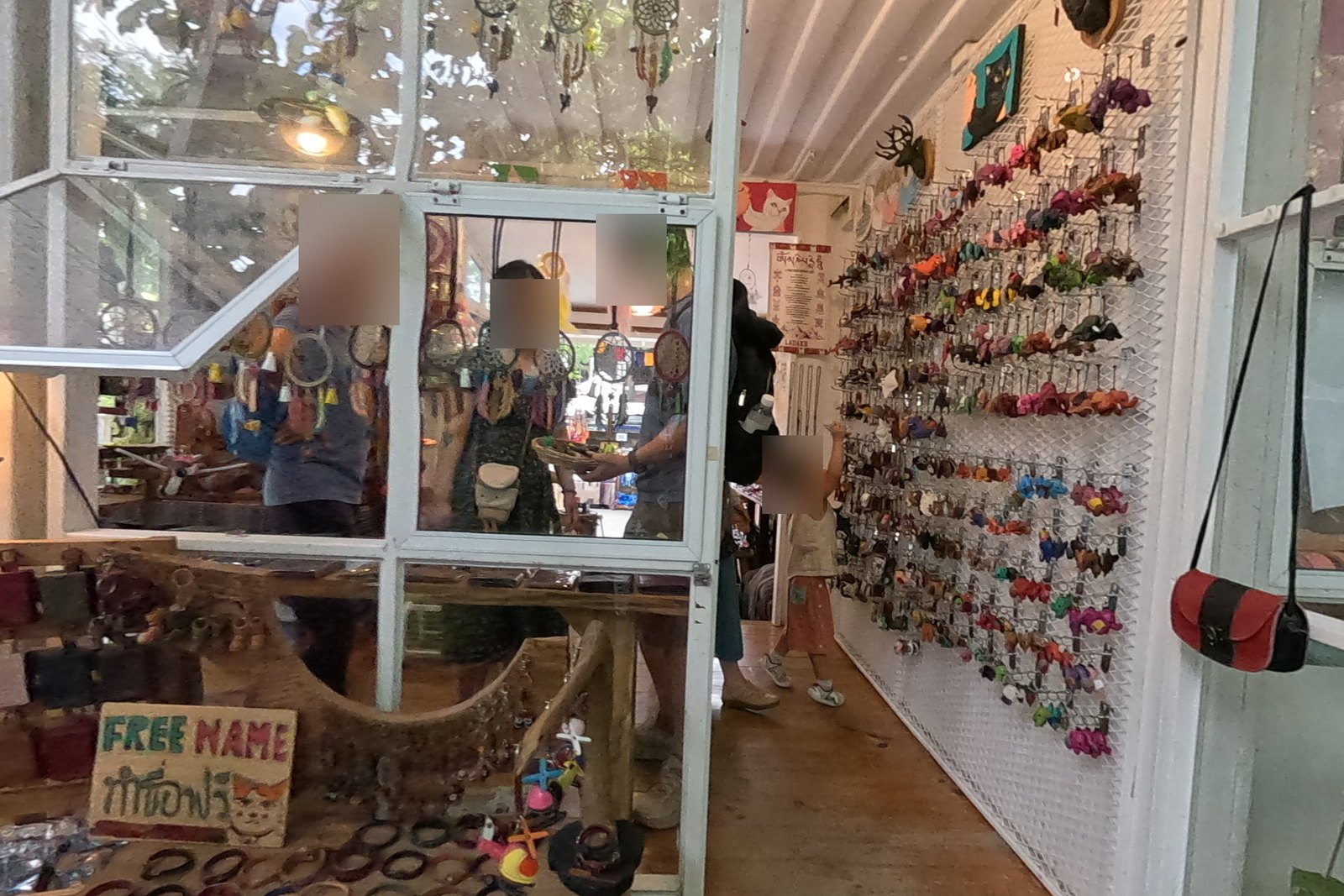 Leather shop: animal key rings and dream catchers — Chamcha Market, San Kamphaeng