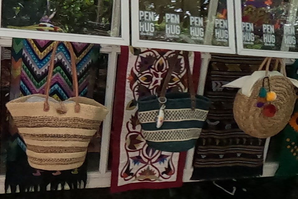 Straw baskets on woven runners — Chamcha Market, San Kamphaeng