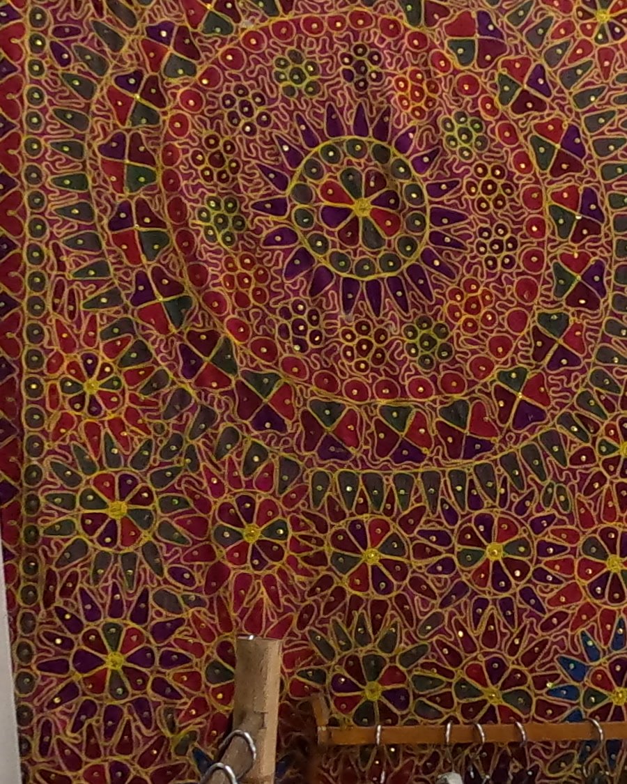 A big embroidered mandala hanging — Chamcha Market, San Kamphaeng