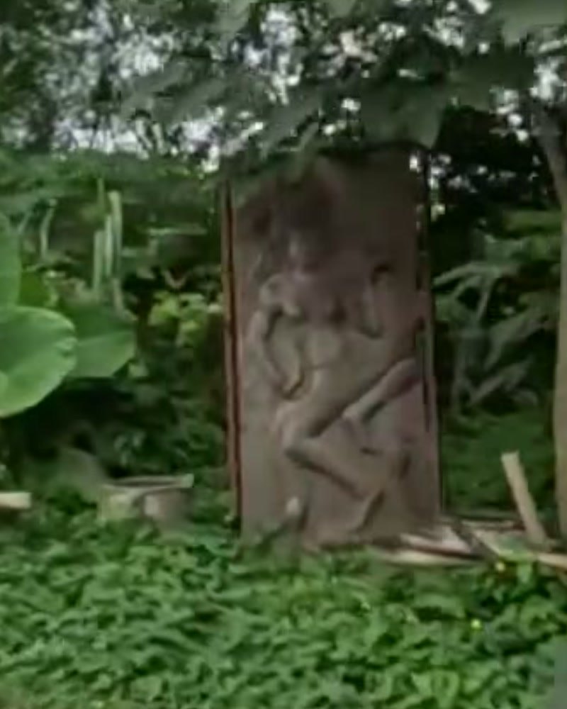 Carved dancing-figure relief by the road — San Kamphaeng