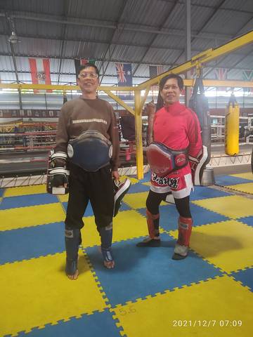 Kru Phon Narupai (right) training alongside his twin brother Kru Lop Narupai (left) at a Muay Thai gym in Thailand. Both are legendary Muay Thai fighters and trainers from Thailand’s Golden Era. The p