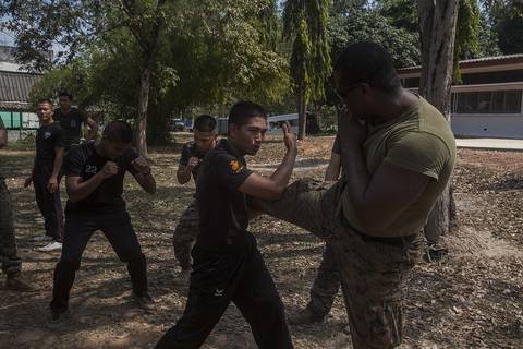 U.S. Marine Corps Sgt. Absalom Burton, with Maritime Raid Force, 31st Marine Expeditionary Unit, practices Muay Thai techniques with Royal Thai Reconnaissance Marines during Cobra Gold 16 at Sattahip,