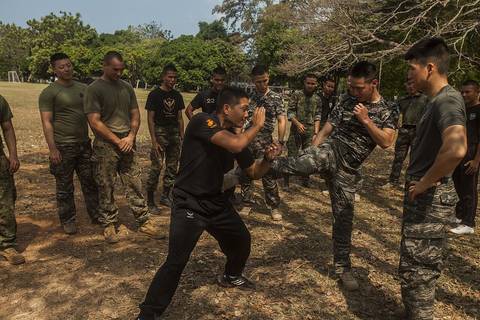 Service members from the Royal Thai, Republic of Korea, and U.S. Marines practice Muay Thai techniques with Royal Thai Reconnaissance Marines during Cobra Gold 16 at Sattahip, Thailand, Feb. 11, 2016.
