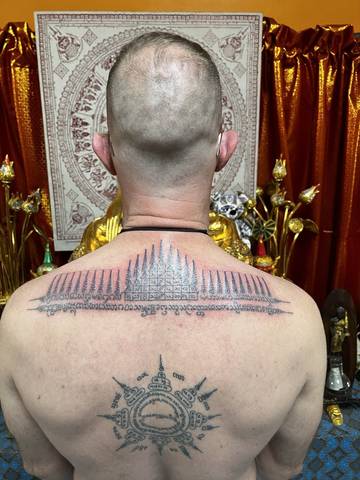 The same yant, with the shrine behind, at Sak Yant Chiang Mai.
