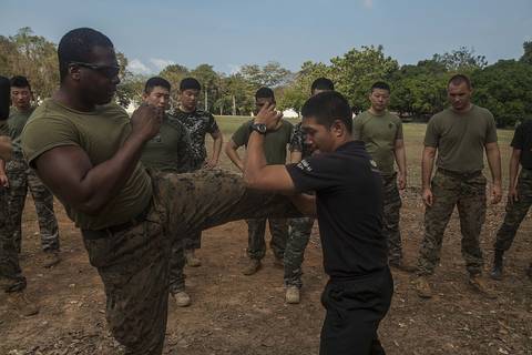 U.S. Marine Corps Sgt. Absalom Burton with Maritime Raid Force, 31st Marine Expeditionary Unit practices Muay Thai techniques with Royal Thai Reconnaissance Marines during Cobra Gold 16 at Sattahip, T