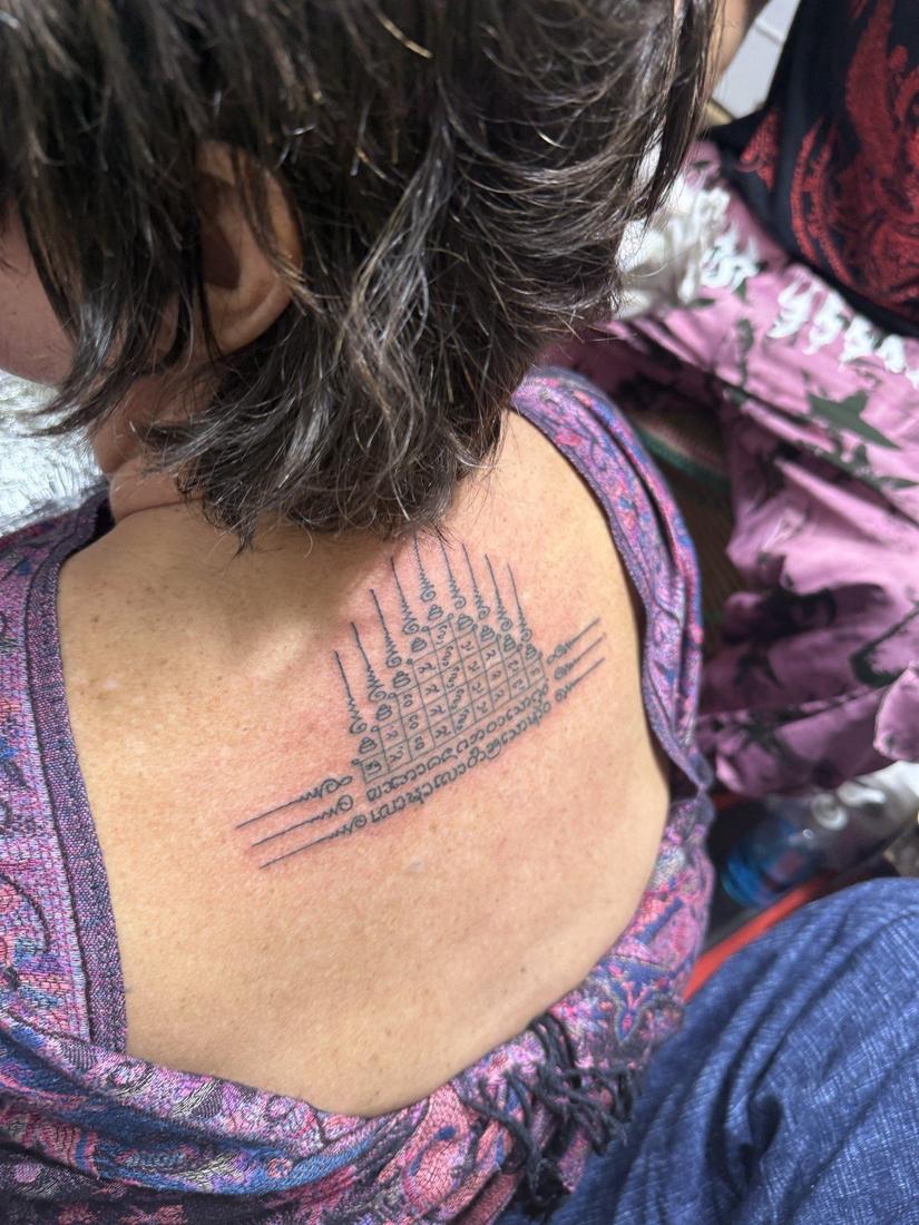 A yant finished on the nape of the neck, at Sak Yant Chiang Mai.
