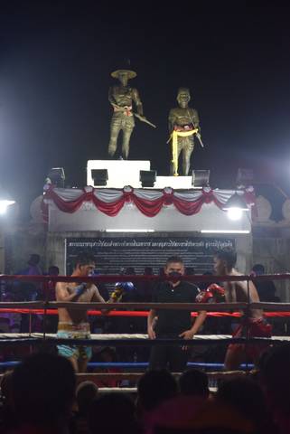 Muay Thai infront of King Taksin & Phraya Pichai Dabhak Monument. Statue found in Hat-Sung Palace (Wat Kungtapao), Uttaradit Province, Thailand.