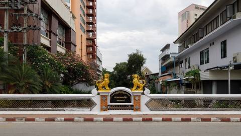 Chiang Mai, Thailand: Bridge over the moat at Loi Kroh Road, decorated with two golden lions