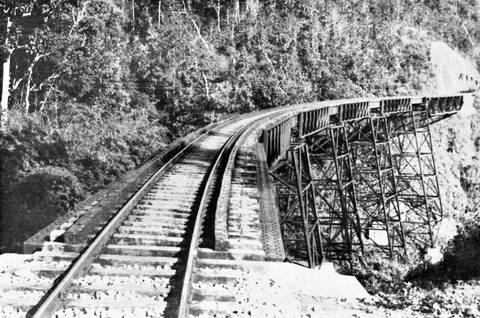 This picture is described as follows:
Original caption: "Northern Line railroad bridge."
