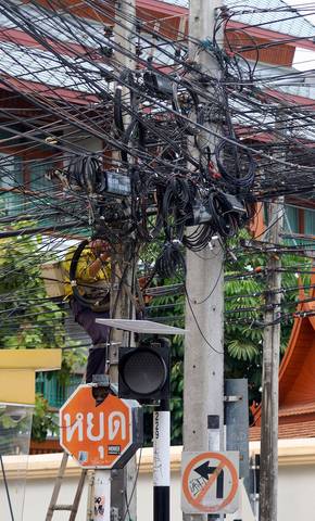 Tangled cables over a street in Chiang Mai, Thailand