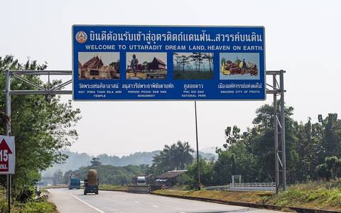 A sign over highway number 11, welcoming visitors to Uttaradit.