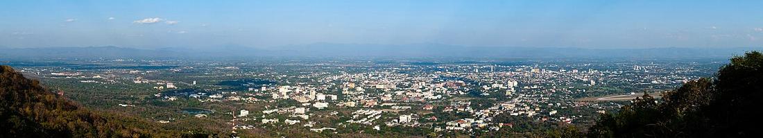Panorama of the city of Chiang Mai, part of the surrounding valley and the mountains east of the city of Chiang Mai. The photo was made from the viewpoint halfway up the road towards Wat Phrathat Doi 