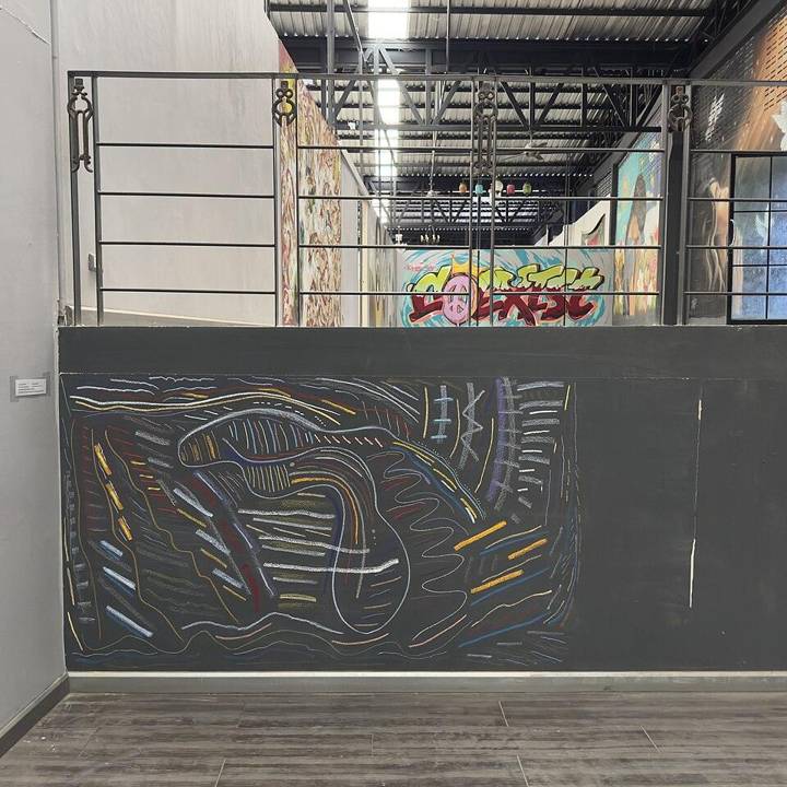Approaching Dawn (2026), mixed media on prepared black wall by E. Mark Gross. Site-specific abstract mural installed at Dream Space Gallery, Chiang Mai, Thailand. Approximate dimensions 5–6 ft × 10–12 ft (1.5–1.8 × 3.0–3.7 m). Abstract composition with layered biomorphic forms and flowing linear str