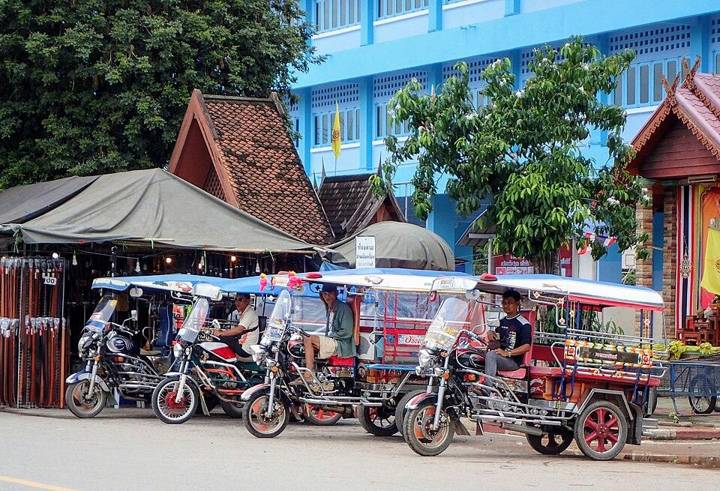 Tuk-tuks waiting for customers, Thailand