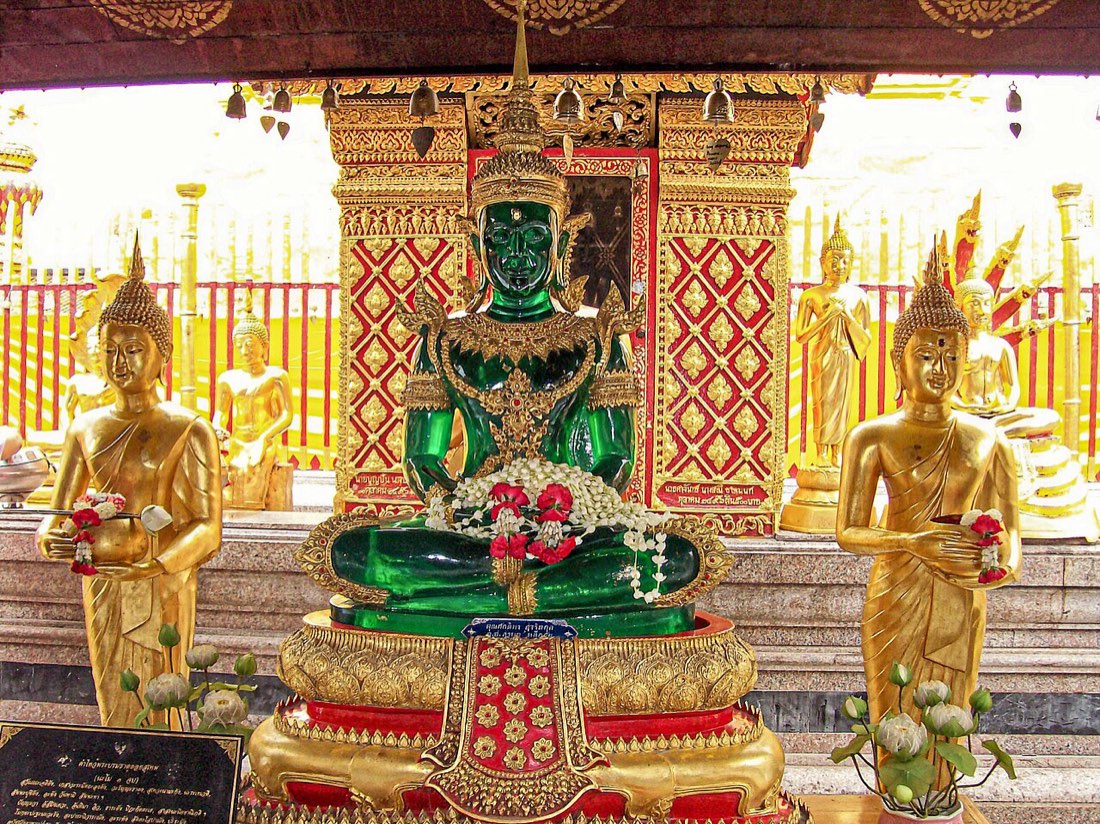 Green Buddha at Doi Suthep temple in Chiang Mai, Thailand. As one of the most sacred temples in northern Thailand, it is a popular destination for tourists and