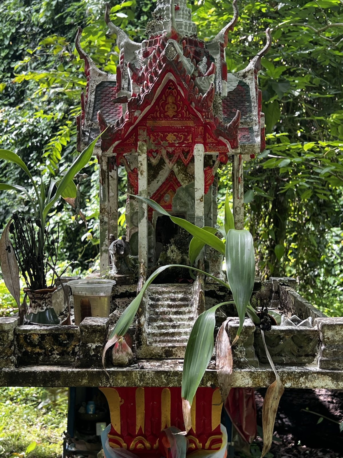 Spirit house in the forest above the falls.