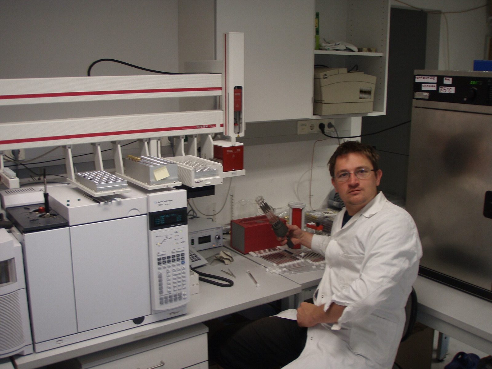 An Agilent GC-MS with a twin autosampler in a research lab.