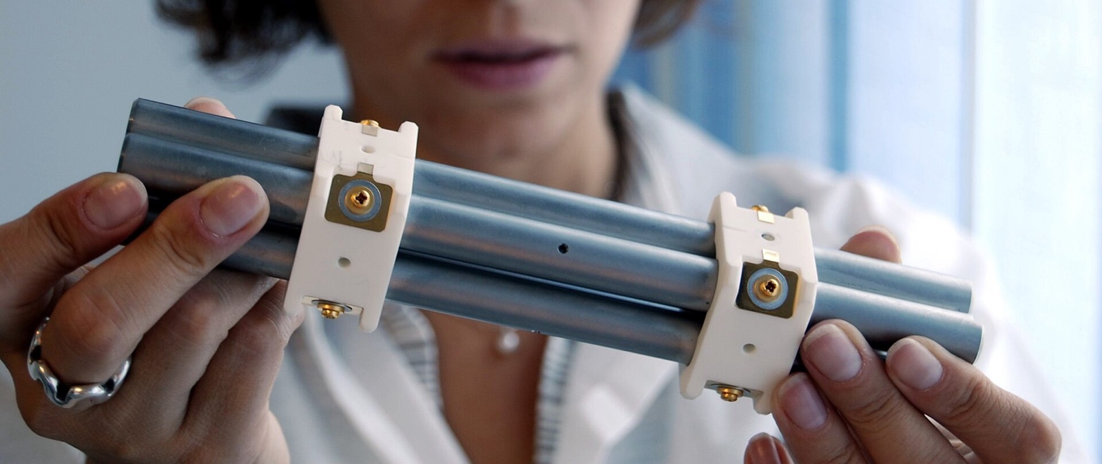 The four metal rods of a quadrupole mass filter.