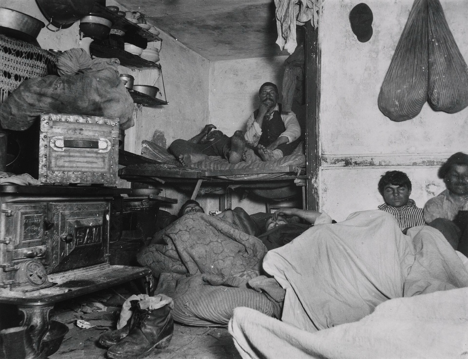 Jacob Riis, 1889: men asleep in a crowded Bayard Street lodging house, New York